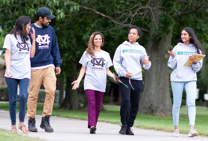 A group of students walking on campus.