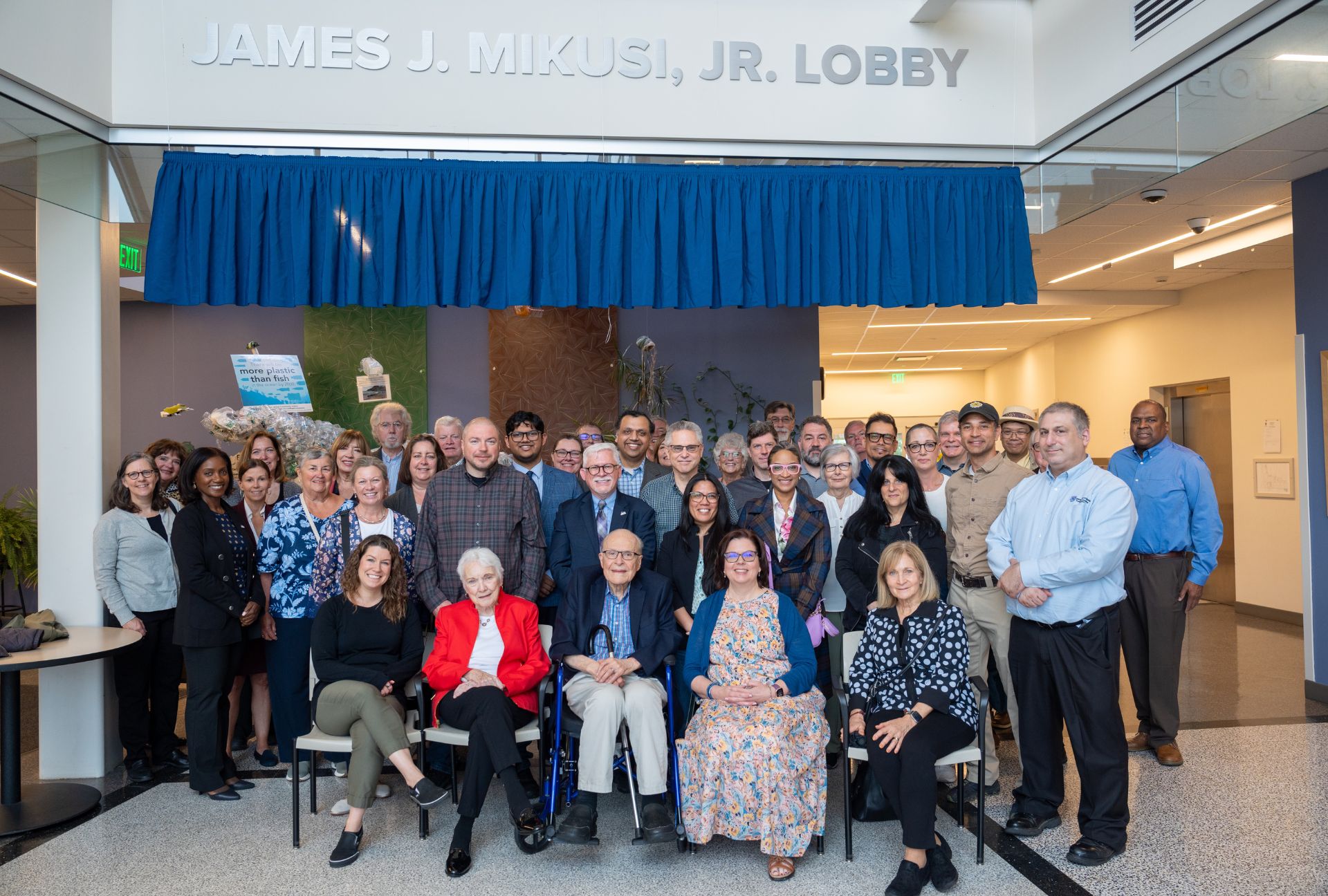 Group photo of those who gathered for the unveiling of the new James J. Mikusi, Jr. Lobby in South Hall