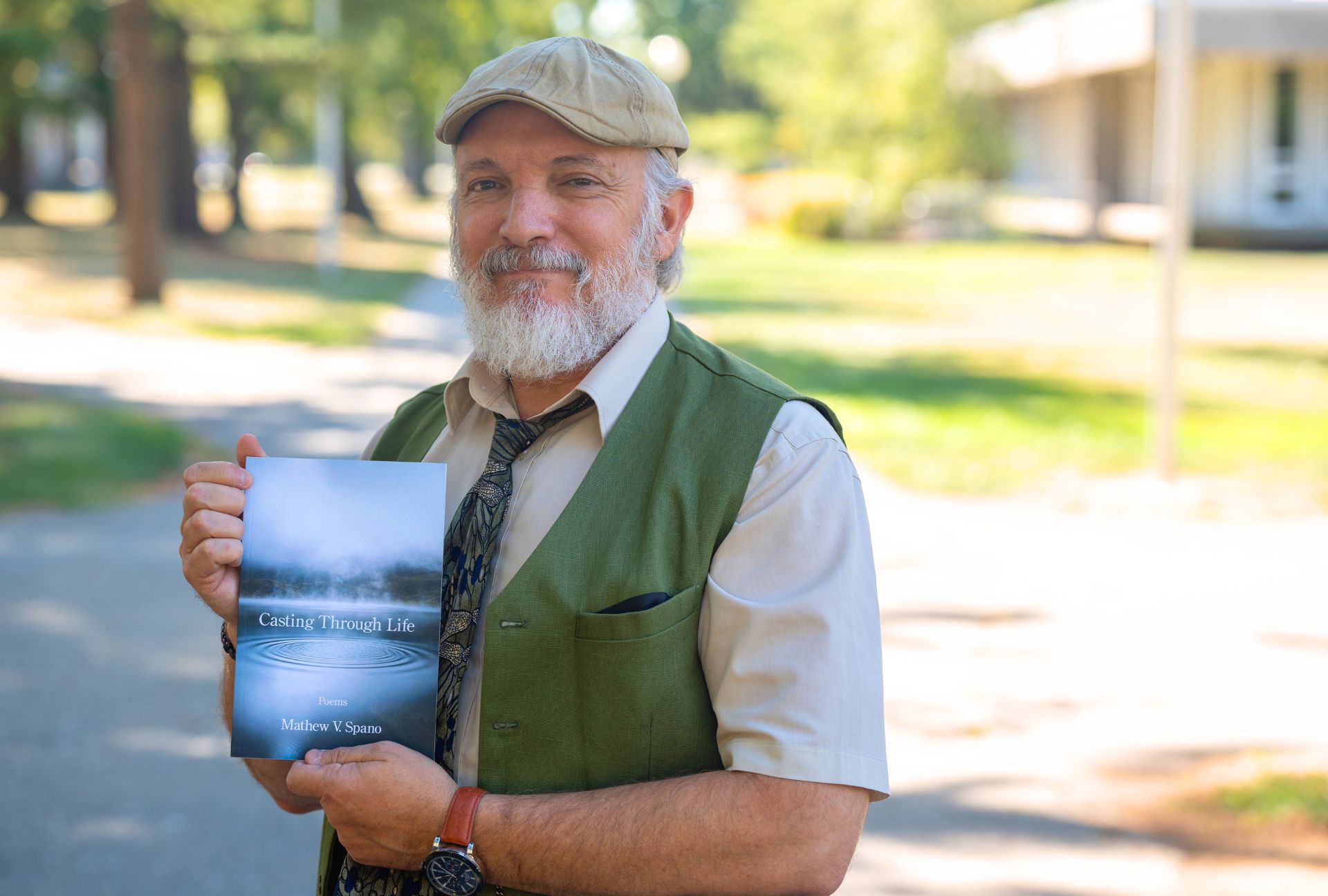 Professor Mat Spano with his book, Casting Through Life