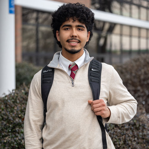 A headshot of Paul Figueiredo, on Middlesex College campus.