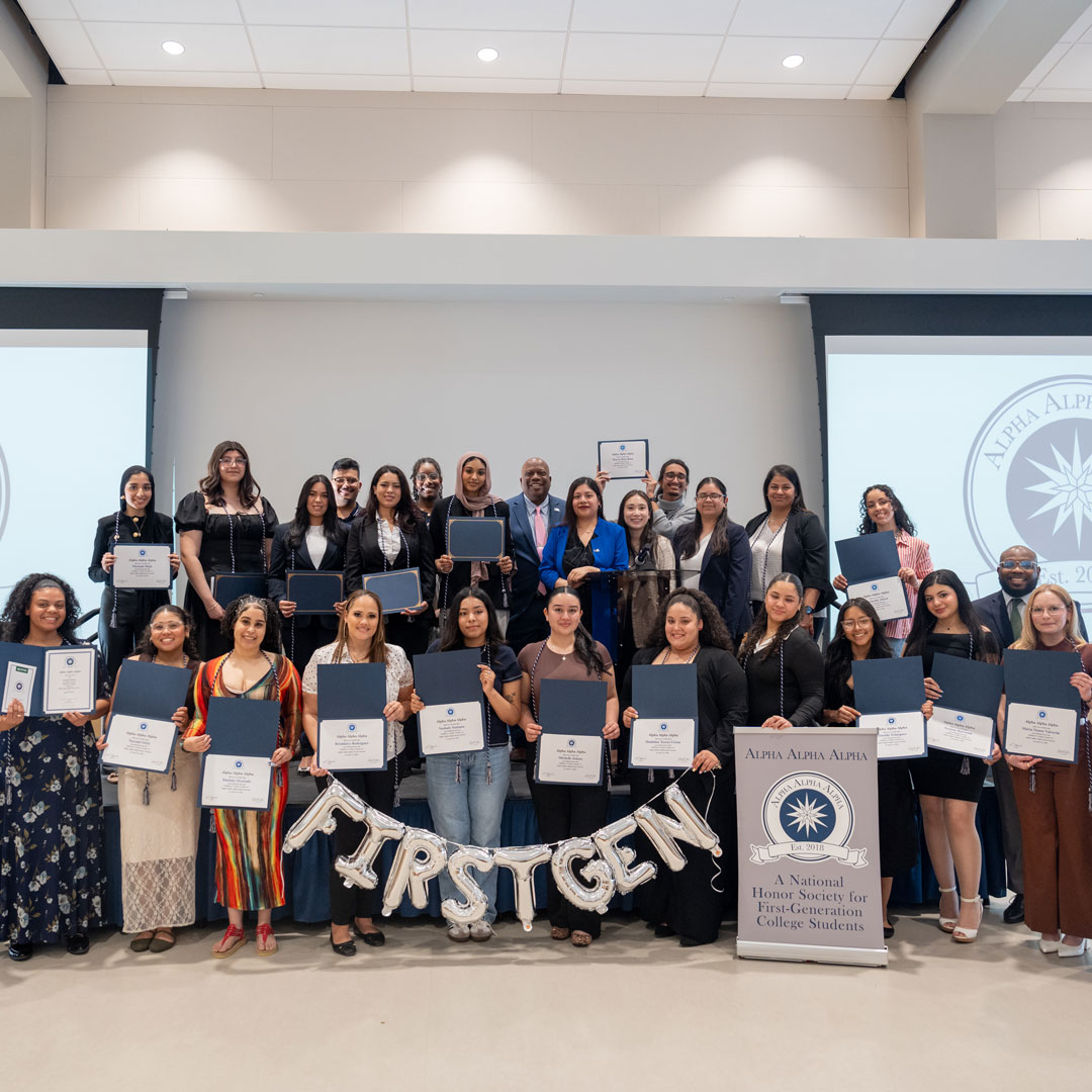 Students being inducted into honor societies. Pictured is a group of students joining Alpha Alpha Alpha, honor society for first-generation students.